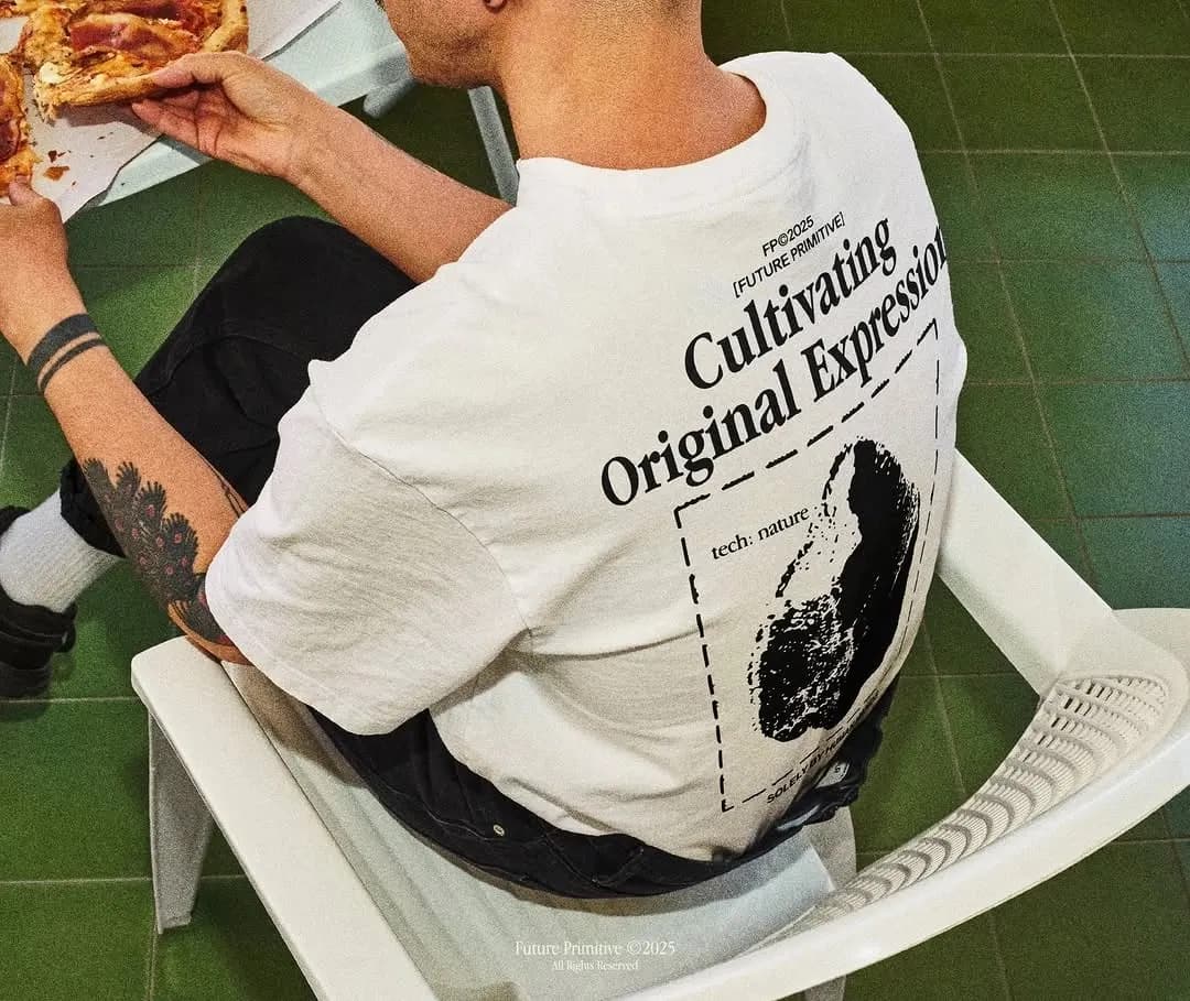 the back of a printed tee, worn at lunch