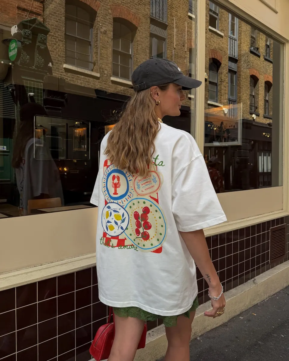 a printed tee, worn down a city street